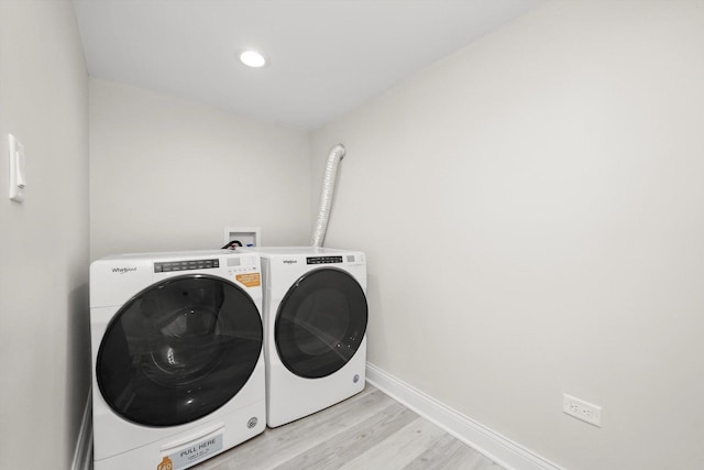 7711 S Honore St, Chicago, IL 60620 - washroom with light wood finished floors and independent washer and dryer