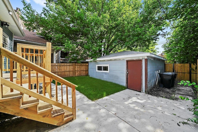 7711 S Honore St, Chicago, IL 60620 - fenced backyard featuring a patio, a wooden deck, and an outdoor structure