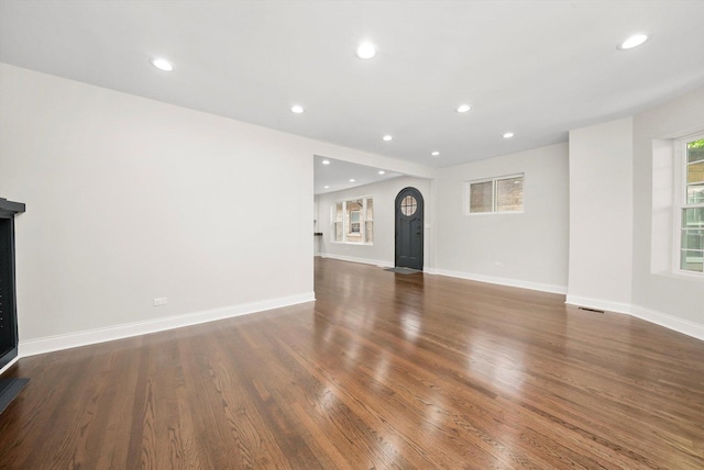 7711 S Honore St, Chicago, IL 60620 - unfurnished living room with wood finished floors and recessed lighting
