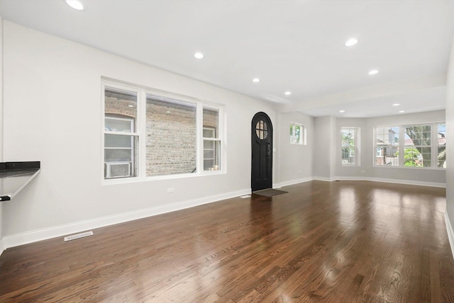 7711 S Honore St, Chicago, IL 60620 - unfurnished living room featuring dark wood-type flooring and recessed lighting