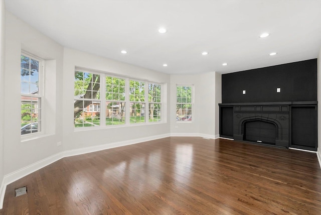 7711 S Honore St, Chicago, IL 60620 - unfurnished living room with plenty of natural light, wood finished floors, recessed lighting, and a fireplace