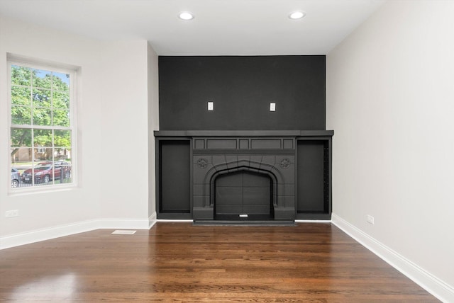 7711 S Honore St, Chicago, IL 60620 - unfurnished living room featuring dark wood-style floors, recessed lighting, and a fireplace