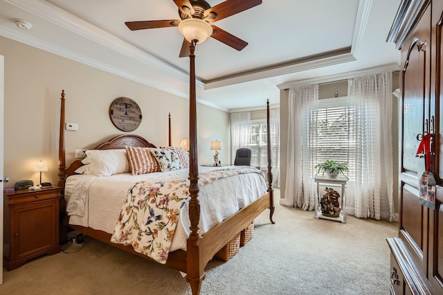 12723 Hawks Bill Ln, Plainfield, IL 60585 - bedroom featuring light carpet, a tray ceiling, ornamental molding, and ceiling fan