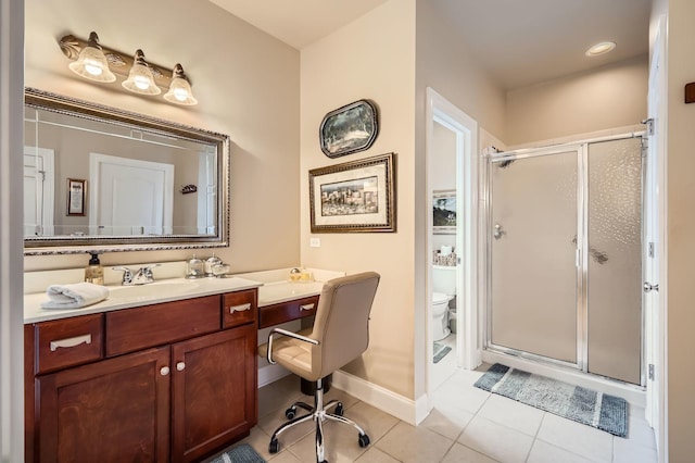 12723 Hawks Bill Ln, Plainfield, IL 60585 - bathroom with tile patterned floors, a stall shower, and vanity