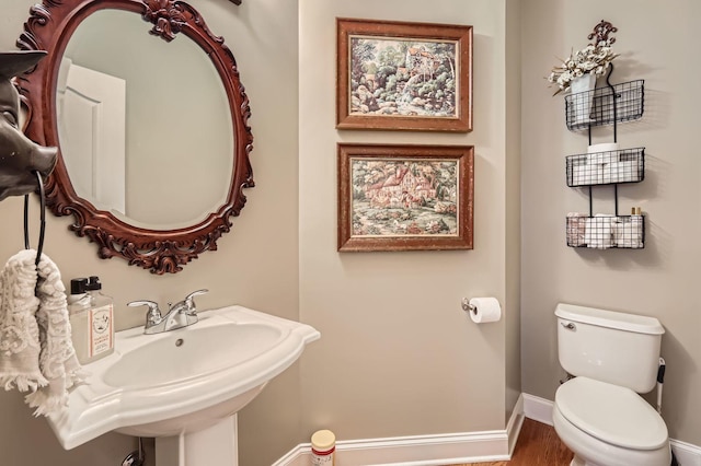 12723 Hawks Bill Ln, Plainfield, IL 60585 - half bathroom with baseboards and wood finished floors