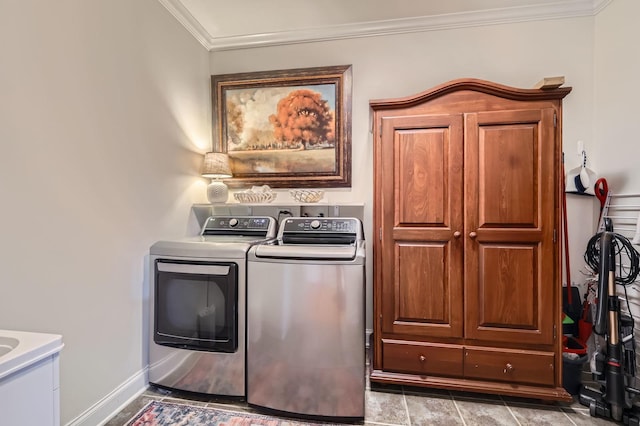 12723 Hawks Bill Ln, Plainfield, IL 60585 - laundry area featuring washer and clothes dryer, crown molding, and cabinet space