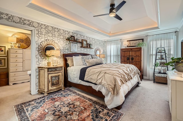 12723 Hawks Bill Ln, Plainfield, IL 60585 - bedroom featuring light carpet, a tray ceiling, crown molding, wallpapered walls, and a ceiling fan