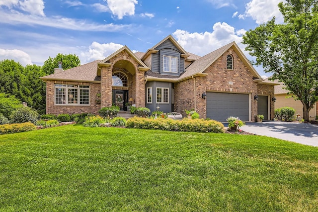 12723 Hawks Bill Ln, Plainfield, IL 60585 - traditional-style house featuring brick siding, concrete driveway, roof with shingles, and a front yard