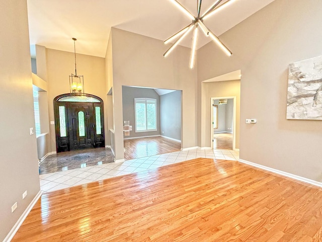 26159 N Hill Ave, Wauconda, IL 60084 - foyer with wood finished floors, a chandelier, and a high ceiling