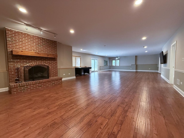 26159 N Hill Ave, Wauconda, IL 60084 - unfurnished living room with wood finished floors, a brick fireplace, and recessed lighting