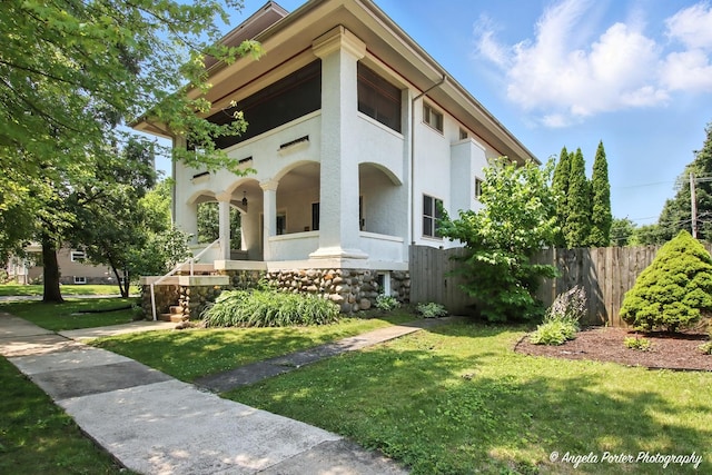 1100 N Hart St, Harvard, IL 60033 - view of side of property with stucco siding and a porch