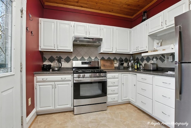 1100 N Hart St, Harvard, IL 60033 - kitchen featuring appliances with stainless steel finishes, under cabinet range hood, wood ceiling, dark countertops, and white cabinets