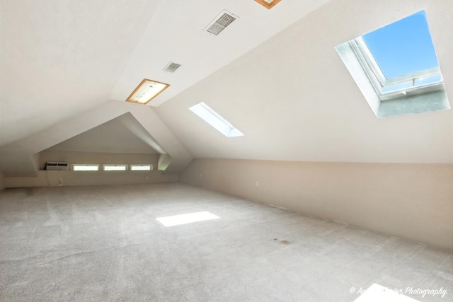 1100 N Hart St, Harvard, IL 60033 - bonus room featuring a skylight, carpet floors, and vaulted ceiling