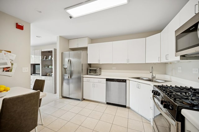 451 Town Place Cir Unit 308, Buffalo Grove, IL 60089 - kitchen with stainless steel appliances, light countertops, white cabinets, light tile patterned floors, and recessed lighting