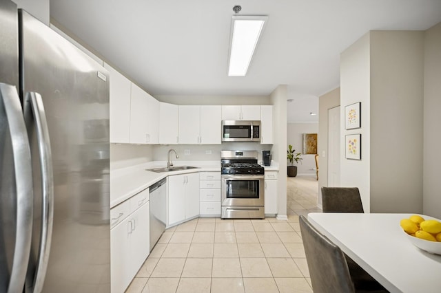 451 Town Place Cir Unit 308, Buffalo Grove, IL 60089 - kitchen featuring stainless steel appliances, light countertops, white cabinets, and light tile patterned flooring