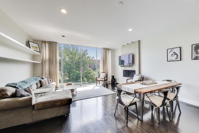 1028 N Hermitage Ave Unit 3, Chicago, IL 60622 - dining area with expansive windows, dark wood-style floors, a large fireplace, and recessed lighting