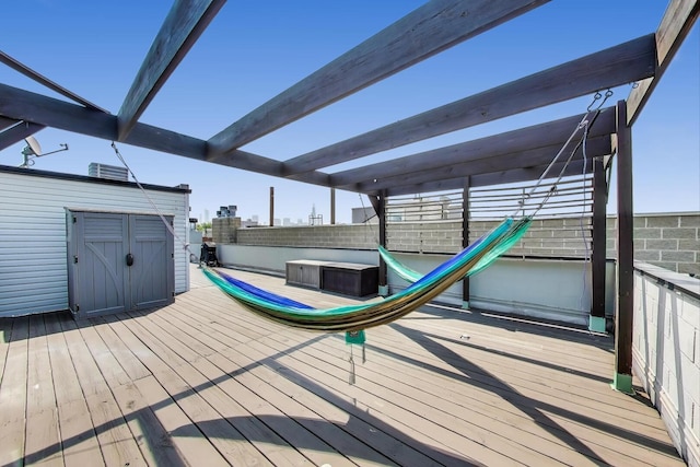 1028 N Hermitage Ave Unit 3, Chicago, IL 60622 - wooden deck featuring a storage shed and a fenced backyard