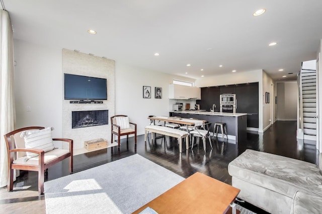 1028 N Hermitage Ave Unit 3, Chicago, IL 60622 - living room with recessed lighting, dark wood-type flooring, and a fireplace