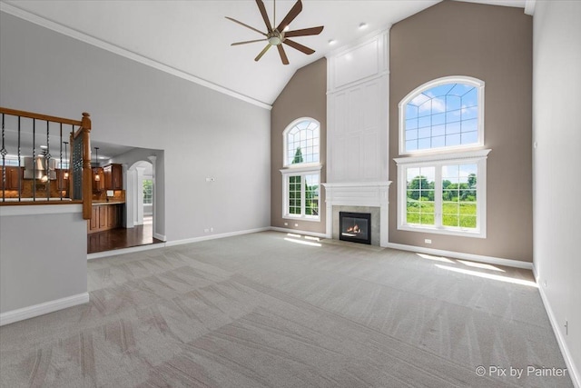 2814 Hapner Way, Batavia, IL 60510 - unfurnished living room featuring high vaulted ceiling, a ceiling fan, carpet flooring, a fireplace, and ornamental molding