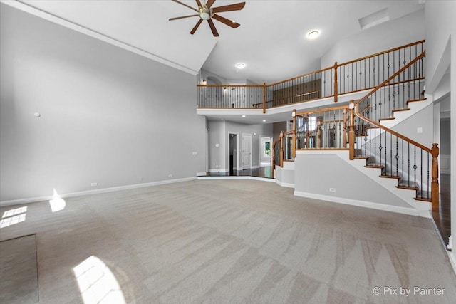 2814 Hapner Way, Batavia, IL 60510 - unfurnished living room with a ceiling fan, carpet floors, stairway, and high vaulted ceiling