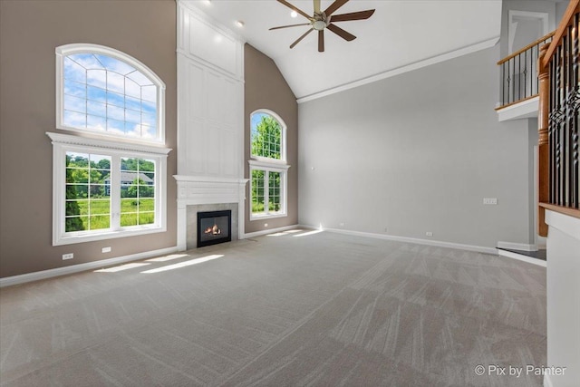2814 Hapner Way, Batavia, IL 60510 - unfurnished living room with high vaulted ceiling, ceiling fan, carpet floors, a large fireplace, and crown molding