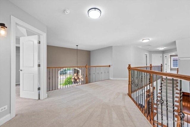 2814 Hapner Way, Batavia, IL 60510 - hallway with carpet floors, a chandelier, and an upstairs landing