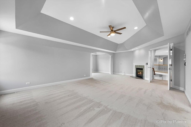 2814 Hapner Way, Batavia, IL 60510 - unfurnished living room featuring ceiling fan, carpet, a raised ceiling, a fireplace with flush hearth, and recessed lighting