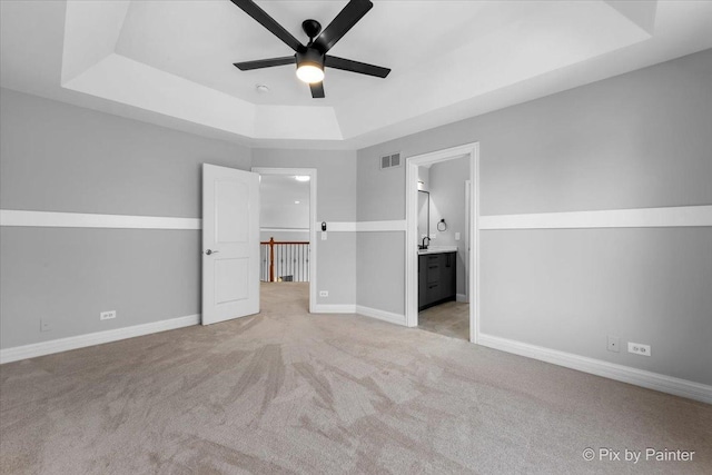 2814 Hapner Way, Batavia, IL 60510 - unfurnished bedroom with a tray ceiling, light carpet, and ensuite bath