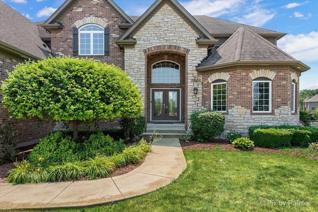 2814 Hapner Way, Batavia, IL 60510 - view of front of home featuring french doors, brick siding, a front yard, and a shingled roof