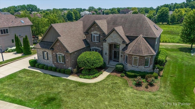 2814 Hapner Way, Batavia, IL 60510 - french country home featuring stone siding, board and batten siding, a front lawn, and a shingled roof