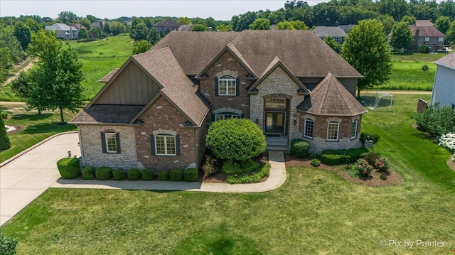 2814 Hapner Way, Batavia, IL 60510 - french country style house featuring stone siding, board and batten siding, a front lawn, and a shingled roof