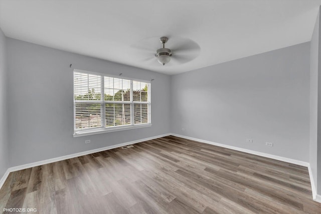 1697 Deer Pointe Dr, South Elgin, IL 60177 - spare room with wood finished floors and a ceiling fan