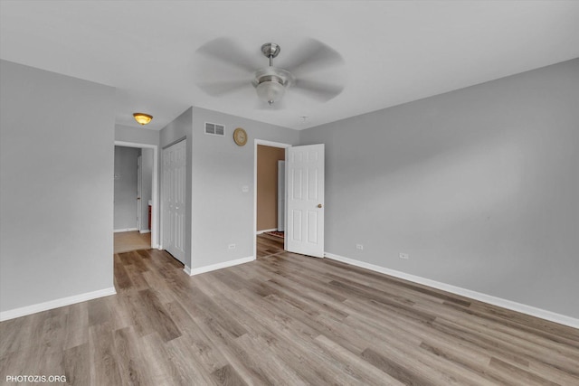 1697 Deer Pointe Dr, South Elgin, IL 60177 - unfurnished bedroom with wood finished floors, a closet, and ceiling fan