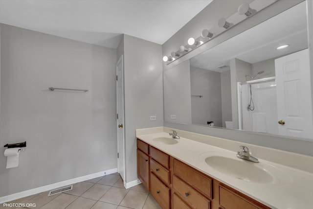 1697 Deer Pointe Dr, South Elgin, IL 60177 - bathroom featuring tile patterned flooring, double vanity, and a stall shower