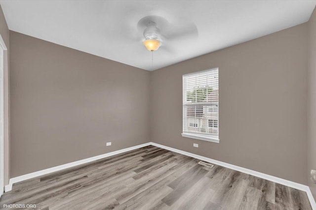 1697 Deer Pointe Dr, South Elgin, IL 60177 - empty room with a ceiling fan and wood finished floors