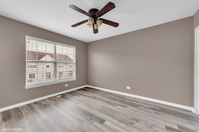 1697 Deer Pointe Dr, South Elgin, IL 60177 - spare room with ceiling fan and light wood-style floors