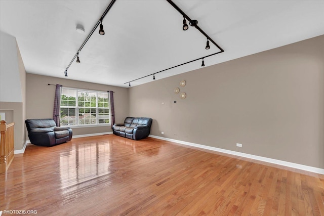 1697 Deer Pointe Dr, South Elgin, IL 60177 - sitting room with rail lighting and light wood-style floors