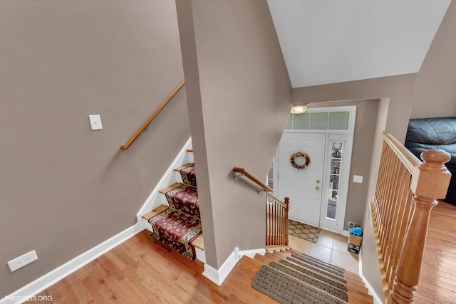 1697 Deer Pointe Dr, South Elgin, IL 60177 - foyer entrance with wood finished floors, vaulted ceiling, and stairs