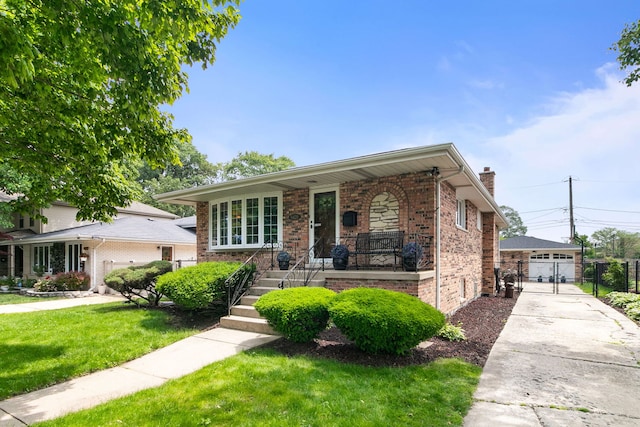 9429 S 55th Ave, Oak Lawn, IL 60453 - view of front of house with a gate, covered porch, brick siding, and a chimney