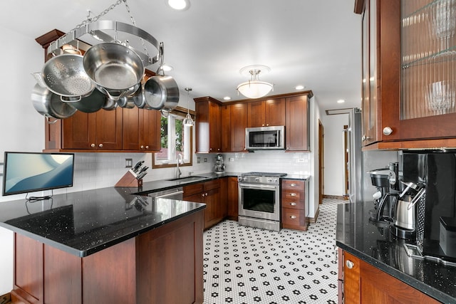 9429 S 55th Ave, Oak Lawn, IL 60453 - kitchen featuring stainless steel appliances, a peninsula, decorative backsplash, recessed lighting, and dark stone countertops