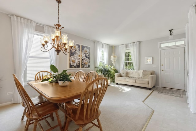 189 E Lark Ave, Cortland, IL 60112 - dining space featuring a chandelier and baseboards