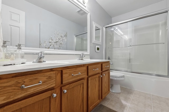 189 E Lark Ave, Cortland, IL 60112 - bathroom with double vanity, tile patterned flooring, and bath / shower combo with glass door