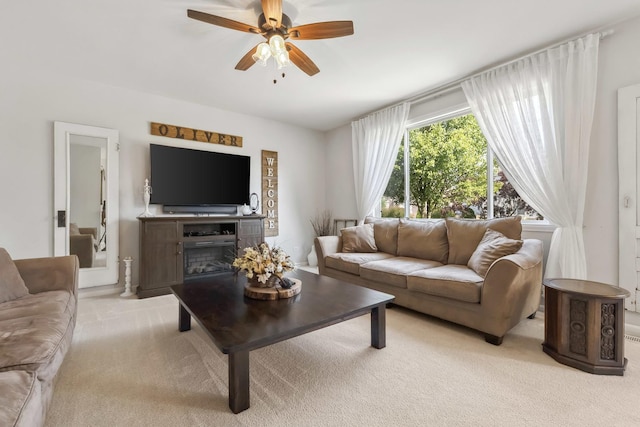 189 E Lark Ave, Cortland, IL 60112 - living area featuring light colored carpet, ceiling fan, and a fireplace