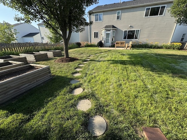 189 E Lark Ave, Cortland, IL 60112 - view of yard featuring a garden and a patio area