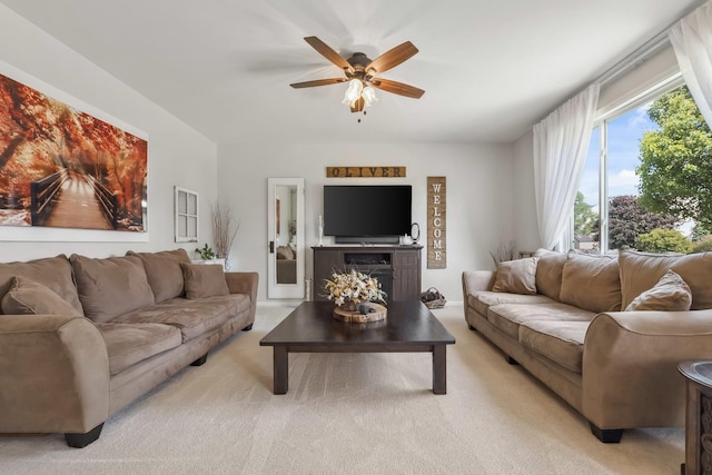 189 E Lark Ave, Cortland, IL 60112 - living room with ceiling fan, light colored carpet, and a fireplace
