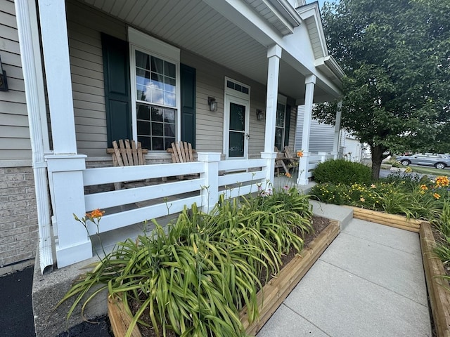 189 E Lark Ave, Cortland, IL 60112 - view of exterior entry with a porch