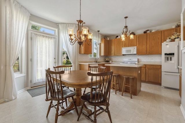 189 E Lark Ave, Cortland, IL 60112 - dining room featuring a chandelier and healthy amount of natural light