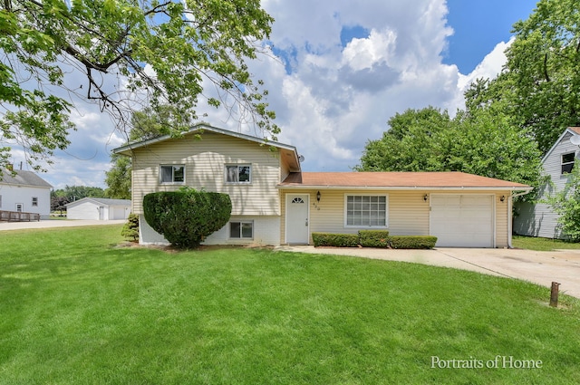 450 E Briarcliff Rd, Bolingbrook, IL 60440 - split level home featuring a front yard, concrete driveway, and a garage
