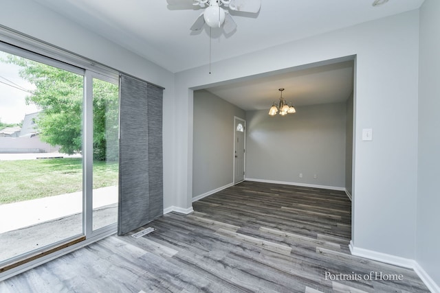 450 E Briarcliff Rd, Bolingbrook, IL 60440 - unfurnished room featuring a chandelier, wood finished floors, and a ceiling fan
