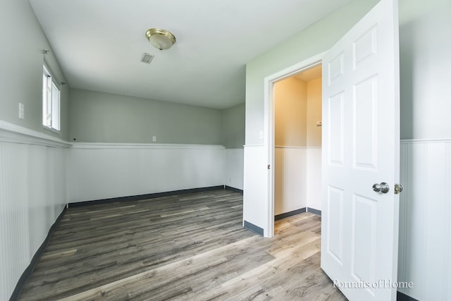450 E Briarcliff Rd, Bolingbrook, IL 60440 - spare room with wainscoting and wood finished floors